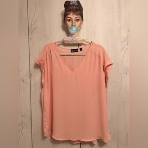 Pink polyester cap sleeve top